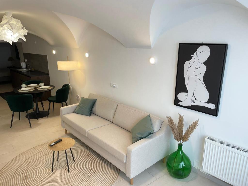 Arched bedroom with warm light at Art Apartment Kranj
